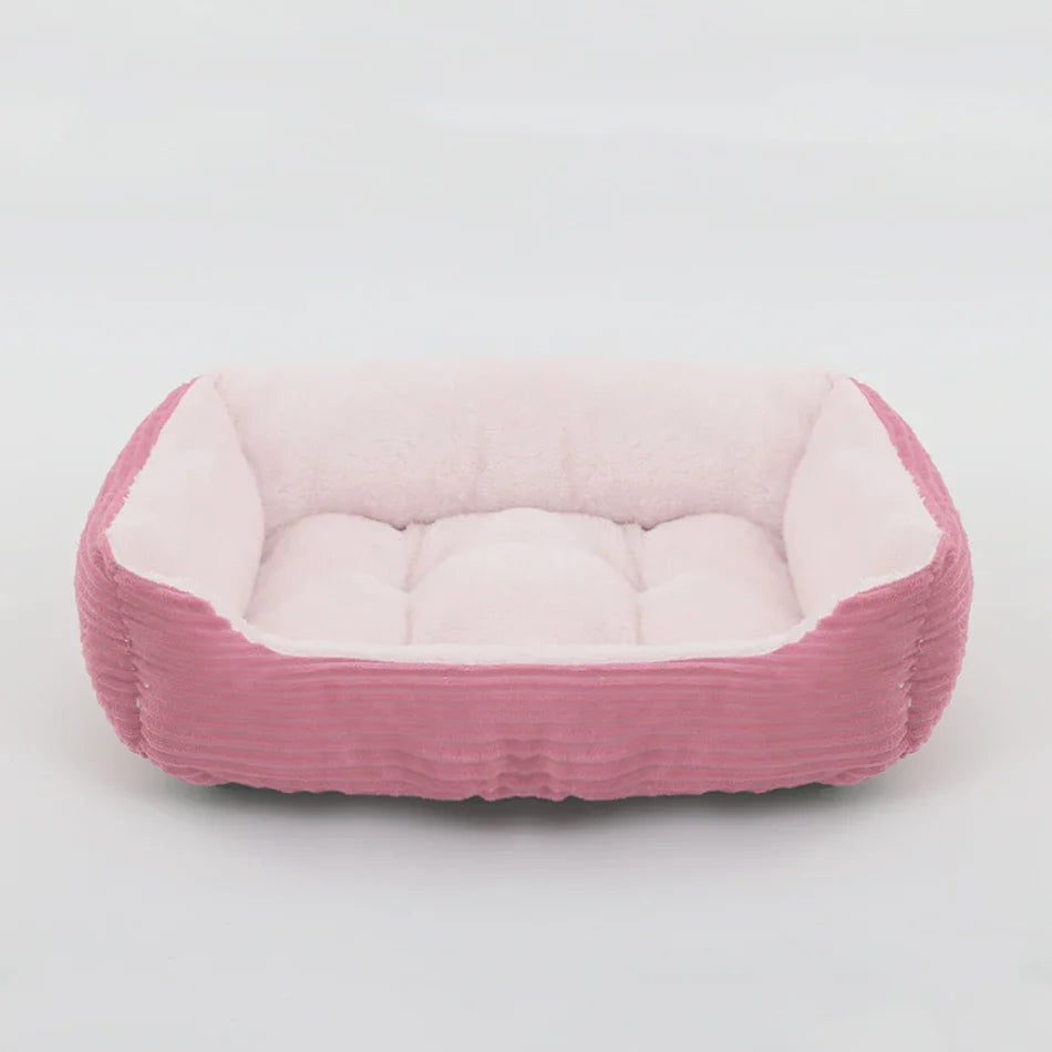 Nuzzinel Puff calming bolster dog bed in pink
