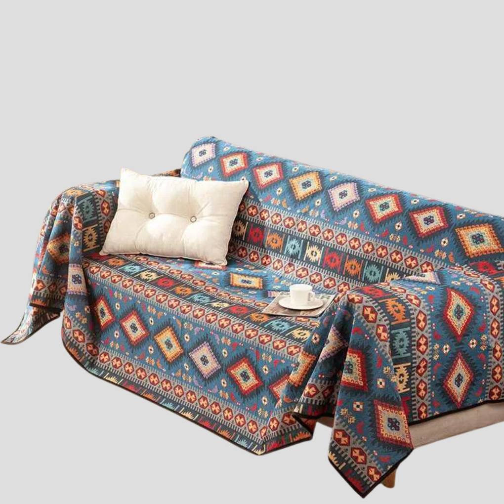 Blue Moroccan jacquard dog throw blanket draped over a sofa