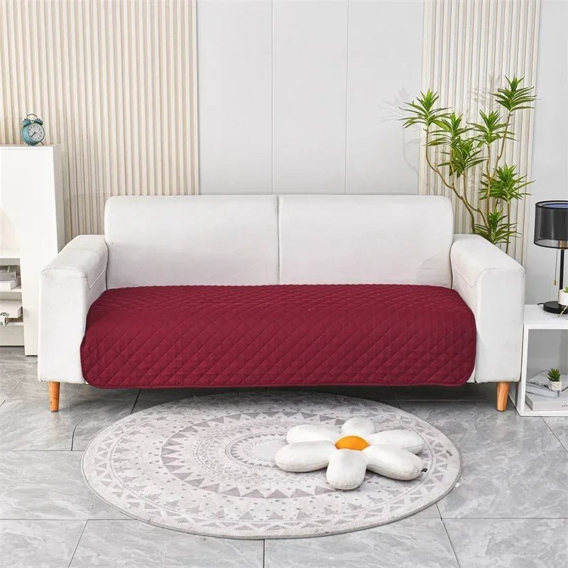 Otter Waterproof Dog Blanket – Red quilted protector on a sofa