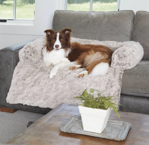 Haven Faux Fur Sofa Protector Bed in Brown — dog relaxing on the plush bolster couch bed