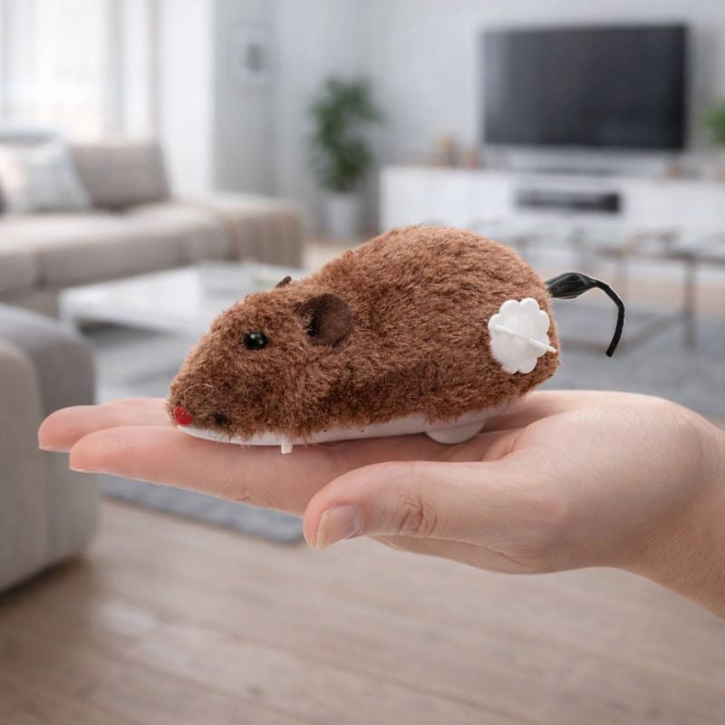 Brown wind-up plush Scamper Chase Toy held in a hand