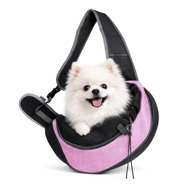 Pomeranian riding in the pink Ranger dog sling carrier