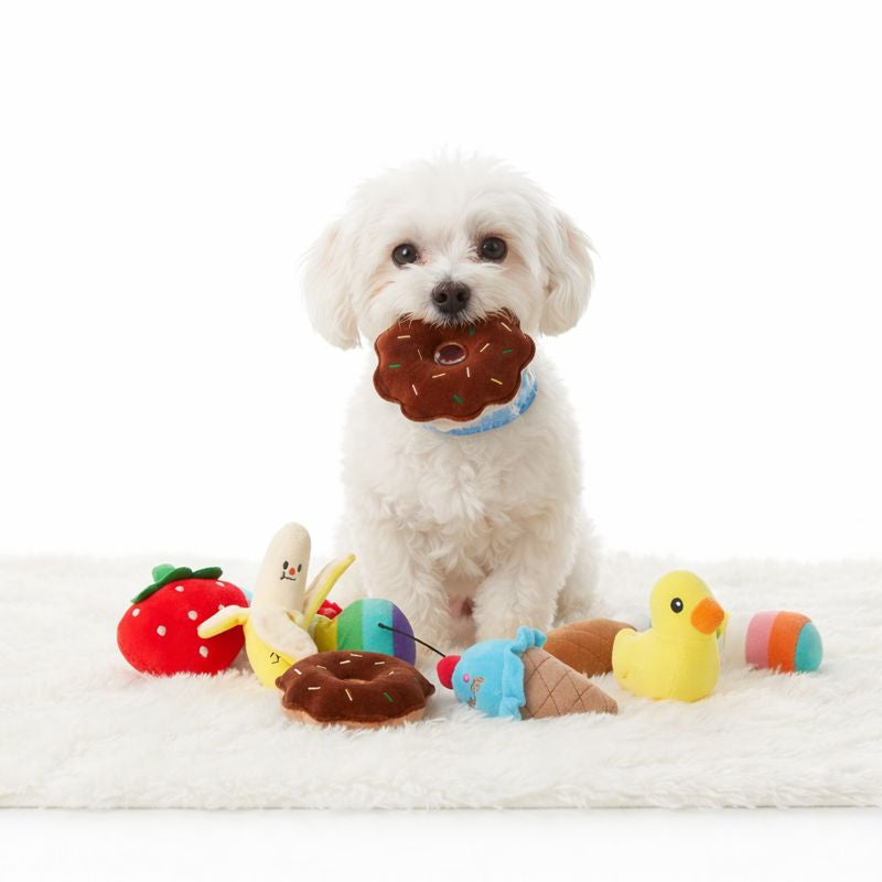 White puppy carrying a plush donut from the Picnic Puppy Plush Toy Set
