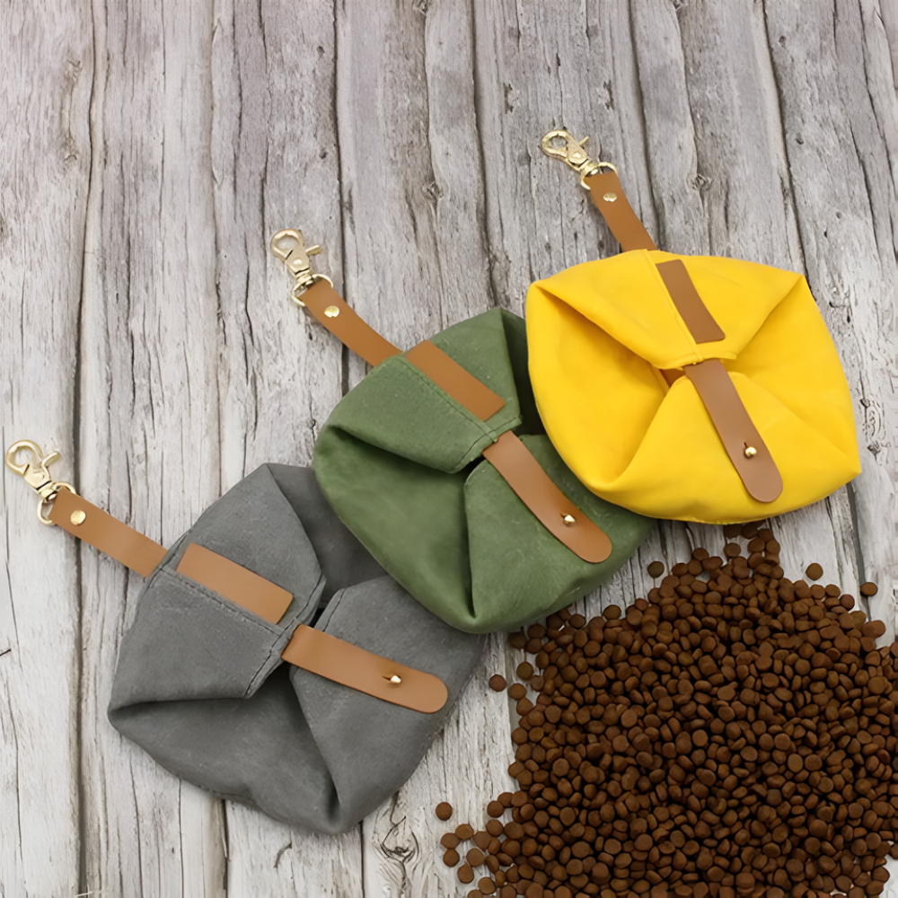 Green, grey and yellow Nuzzinel Pebble foldable travel dog bowls folded flat