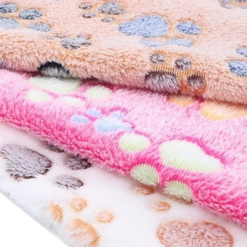 Close-up of the soft paw-print coral fleece texture