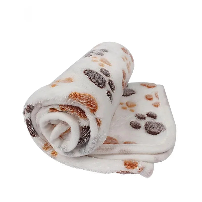 White paw-print coral fleece dog blanket