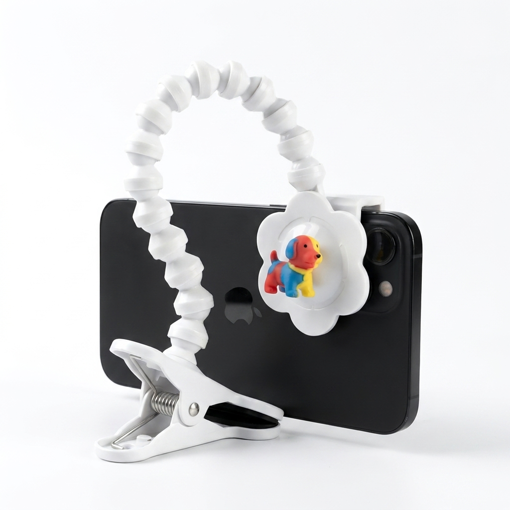 Snap Dog Photo Clip in white on a smartphone with a toy by the lens