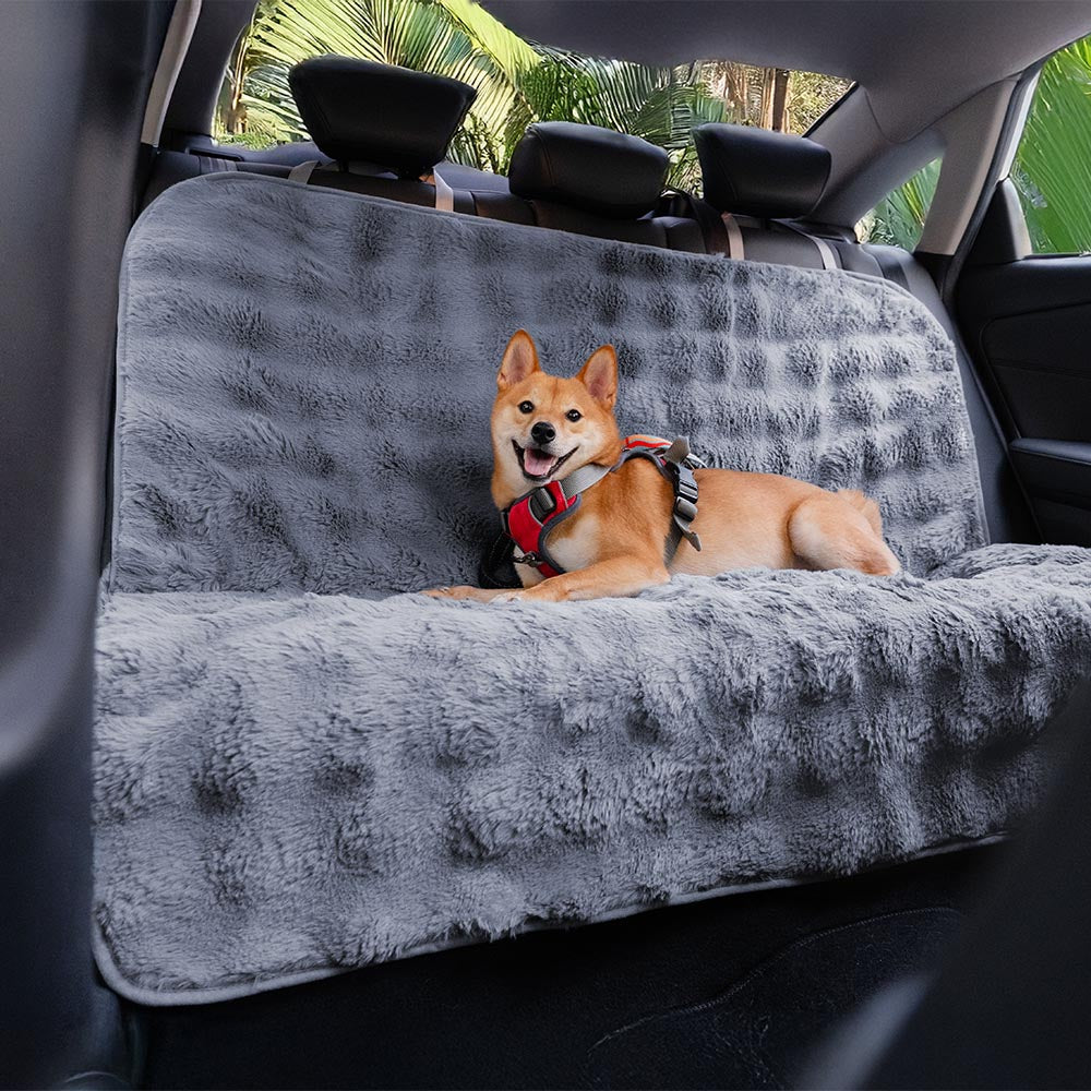Roadie grey faux-fur dog car seat cover with a dog