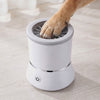 A dog's paw being gently cleaned by the rotating bristles inside the Dip automatic dog paw cleaner