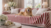 A dog settling onto a Cove chenille-covered sofa