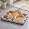 Corgi settling onto the Willow woven-rattan cooling dog mat