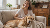 Woman with her Golden Retriever wearing the gold dog and cat pendant necklace