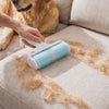 Rolling the Fuzz reusable dog hair remover over a couch cushion to lift away dog hair