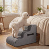 Small dog calmly climbing the gray Nimbus orthopedic dog stairs