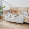 Haven Faux Fur Sofa Protector Bed — a Labrador settling calmly onto the plush couch bed