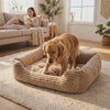 Dog settling into the Nuzzinel Puff calming bolster dog bed