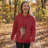 Woman walking with her dog in the Kanga carrier hoodie pouch