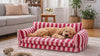 Doodle puppy settling into the Chester calming dog sofa bed