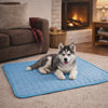 Husky settling onto the Shade cooling dog mat to cool off