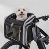 Small dog riding happily in the Cruiser bike basket carrier