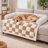 Dog settling down to rest on the Hearth Checkered Dog Sofa Cover