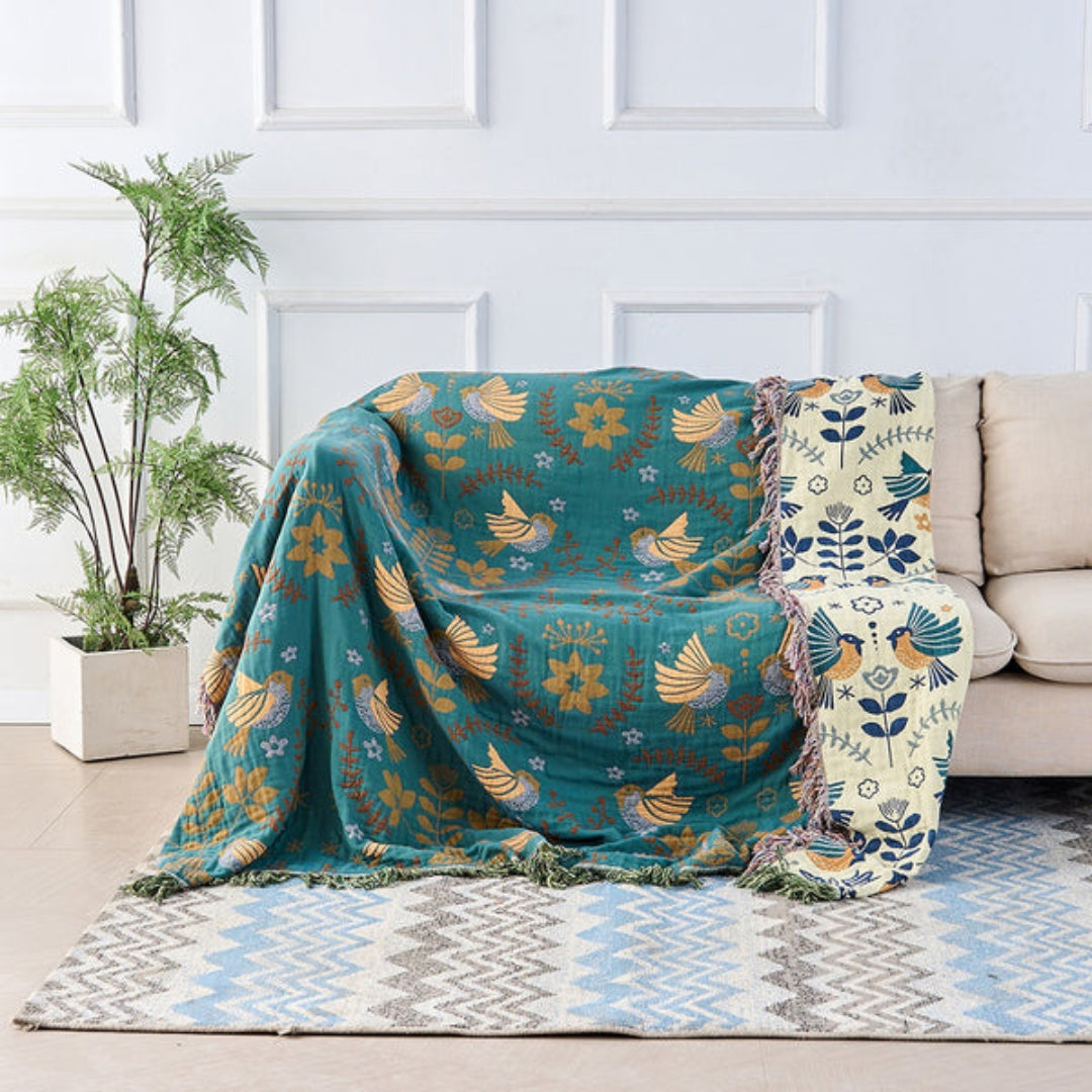 Wren Scandinavian Bird Throw – reversible throw over an armchair showing both sides